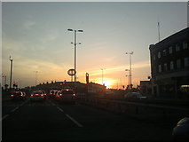 TQ4388 : View of the sunset from the traffic lights at Gants Hill Roundabout by Robert Lamb