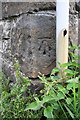 Benchmark on outbuilding at High Birkwith