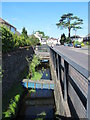 Drainage channel on the south side of College Road, EN8