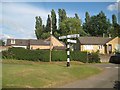 Dodford: Village green direction sign