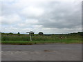 Lonely postbox by a signpost