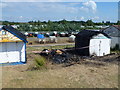TF6637 : Burnt out beach hut on North Beach, Heacham by Richard Humphrey