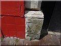 Damaged benchmark on #104c St Mary St, Weymouth