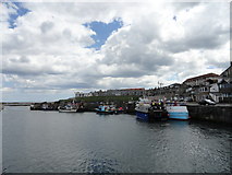 NU2232 : View of Seahouses harbour by Robert Graham