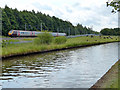 Virgin train next to the Trent & Mersey Canal