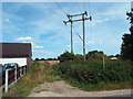 TM1629 : Pylon and footpath near Wix by Malc McDonald