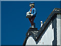 A Western Express paper-boy on top of 48 Mill Street, Bideford