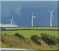 SX1793 : Rainclouds, turbines and pylons, Marshgate, Cornwall by Edmund Shaw