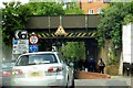 Kingsgate Road runs under a railway bridge