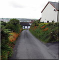 Orange and green banks near Harbour Village, Goodwick