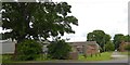 Farm buildings and a phone box in Duggleby