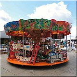 SJ9494 : Children's carousel by Gerald England
