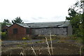 Decrepit wooden building by the football pitch