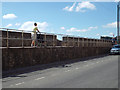 Raised footway by Den Promenade with gap through to the sea wall walk, Teignmouth