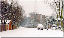 TQ3371 : In snowstorm, up College Road to Raleigh Court, Lymer Avenue, with the BBC Transmitter beyond, 1985 by Ben Brooksbank