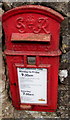 King George VI postbox in a Clearwell wall