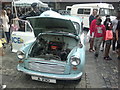 View of a Morris Minor 1000 police car in Romford Market