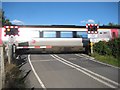 Train passing through level crossing