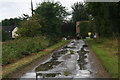 TA0205 : Wet road to Low Barff Farm near Howsham by Chris