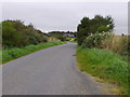 View north up the minor road at Drum Stone