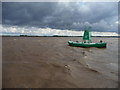 TA0424 : Humber float no 27 at low tide in stormy weather by Christine Johnstone