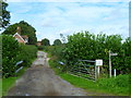 Looking north on Ford Lane from footpath junction