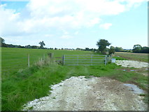 TQ1006 : Field gate and stile east of Clapham by Shazz