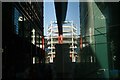 View of the building site on Throgmorton Street reflected in 125 Old Broad Street