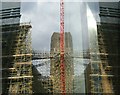 View of the Tate Modern chimney and scaffolding reflected in the Blue Fin building #2