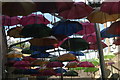 View of a canopy of colourful umbrellas in Vinopolis Piazza #3