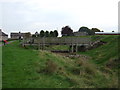 NY5129 : Moat and footbridge, Penrirth Castle by JThomas