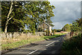 Lead Road passing house at Lane Head