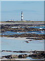 North Ronaldsay: rocks, sand and a lighthouse view