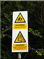 TM0120 : MOD sign on Lay-by off the B1025 Merdea Road by Geographer