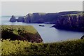 NO8990 : Coastal cliffs at Bridge of Muchalls by Alan Reid