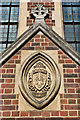 Plaque above door to the Church of the Holy Family