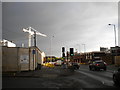 Bright tower crane against a dull sky