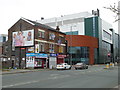 Old shops in Upper Brook Street, next to new university buildings