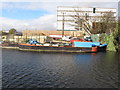 TQ1079 : Workboat at wharf by Bull's Bridge by David Hawgood