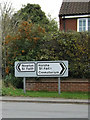 TG2116 : Roadsigns on Manor Road by Geographer