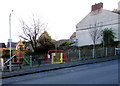 Yellow gate entrance to Baneswell playground, Newport