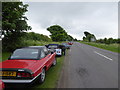 Classic cars parked on the verge of the B1225 near Wold View House