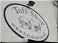 TL3556 : Toft Shop sign by Geographer