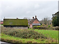 A barn and Rose Cottage