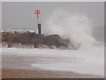 SZ1690 : Hengistbury Head: a breakwater is hit by a wave by Chris Downer