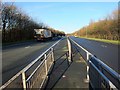 SD5526 : Looking north along the A6 London Way from a foot crossing by Adam C Snape