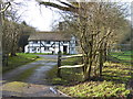 House by woodland off Waterlands Lane