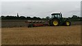 TL1183 : Ploughing stubble by Michael Trolove