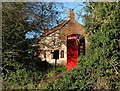 In Kersall - disused phone box and cottage