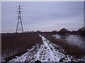 SK4328 : Snowy footpath and pylon by the River Trent by Ian Calderwood